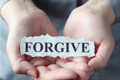 forgive paper in hand